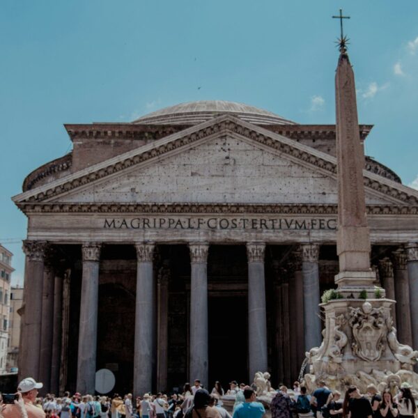 a group of people standing in front of a building